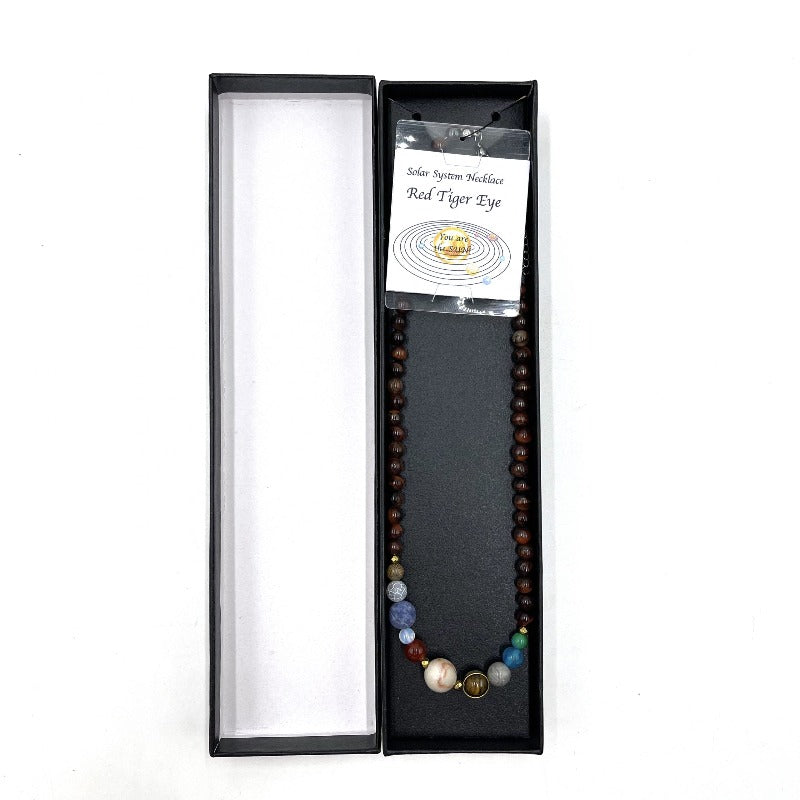 Solar System Necklace Red Tiger Eye Red Tiger eye is a powerful stone that aids harmony and balance. Tiger Eye helps you to release fear and anxiety. It stimulates taking action, and helps you to make decisions with discernment and understanding.   Size of bead 0.6cm  SKU: SN6