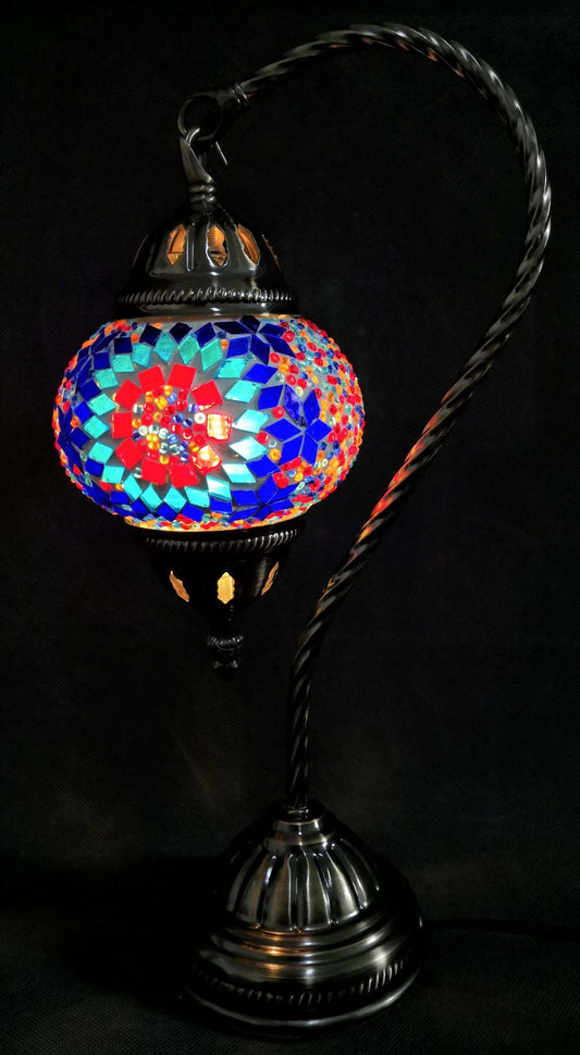 Mosaic lamp with colorful design on a black background