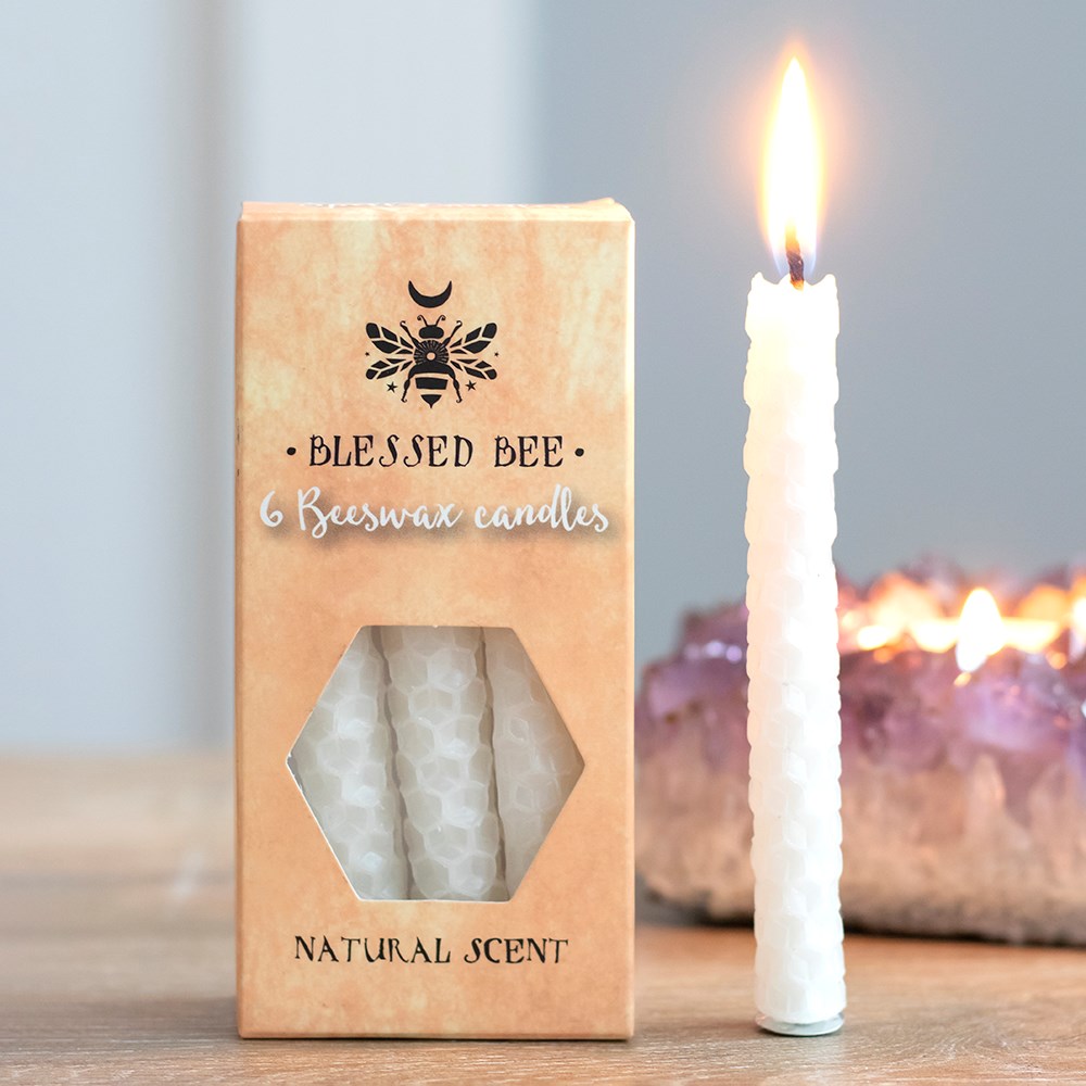 Pack of 6 White Beeswax Spell Candles 
H:10 x D:1 cm - A box of 6 white Blessed Bee beeswax candles useful for spell work involving peace and happiness. Light, natural scent. Approximate burn time of 1 hour. 100% linen wick. Non-toxic. Do not ingest.
SKU: SDBW48738