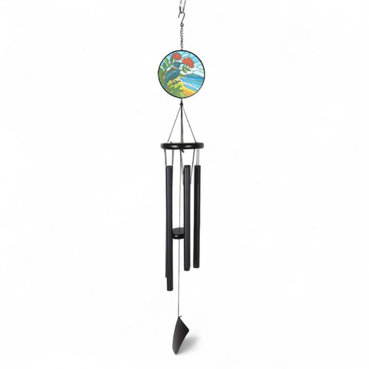 Tui Suncatcher Wind Chime 40" Black
The Tui is a striking native bird of New Zealand, known for its distinctive white throat feathers and melodious song. With iridescent dark plumage and a bold, curved beak, the Tui is a symbol of the country's rich natural heritage. A skilled singer, the Tui can mimic various sounds and is often heard calling in forests and gardens. It plays a key role in pollination and is admired for its beauty, intelligence, and unique vocal abilities. With a Glass Suncatcher can help b