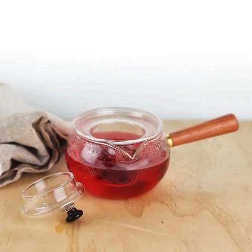 MagicT - Japanese Style Kyusu Teapot When it comes to tea rituals Japan has a history to put on the table. MagicT’s Kyusu Japanese Style teapot is made of high borosilicate glass ready to create your tea ritual. It has a solid wood side handle which makes the serving fancier and easier. Capacity: 500 ml