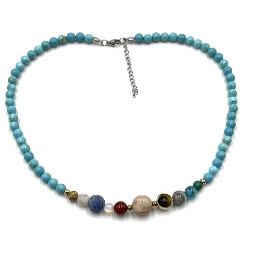 Solar System Necklace Turquoise (Howlite) Turquoise (Howlite) has a calming effect and has a strong positive energy. The stone helps the bearer to control anger and be less critical. It stimulates ambition and patience, but also strengthens the memory and promotes the eagerness to learn. The stone may help reduce insomnia due to its strong calming effect. Size of bead 0.6cm SKU: SN1