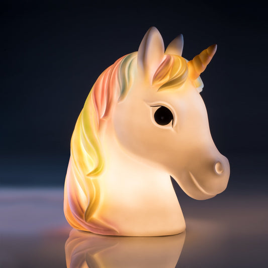 Pretty Unicorn Table Lamp LED table lamp of a white unicorn with a rainbow mane Soft warm glow and safe low-voltage adaptor makes it perfect for child’s bedrooms Great decor for during the day too!  21.50 (L) x 14(W) x 23.80 (H) cm USB Charger + 2 meter cord  SKU: XW-TL/U