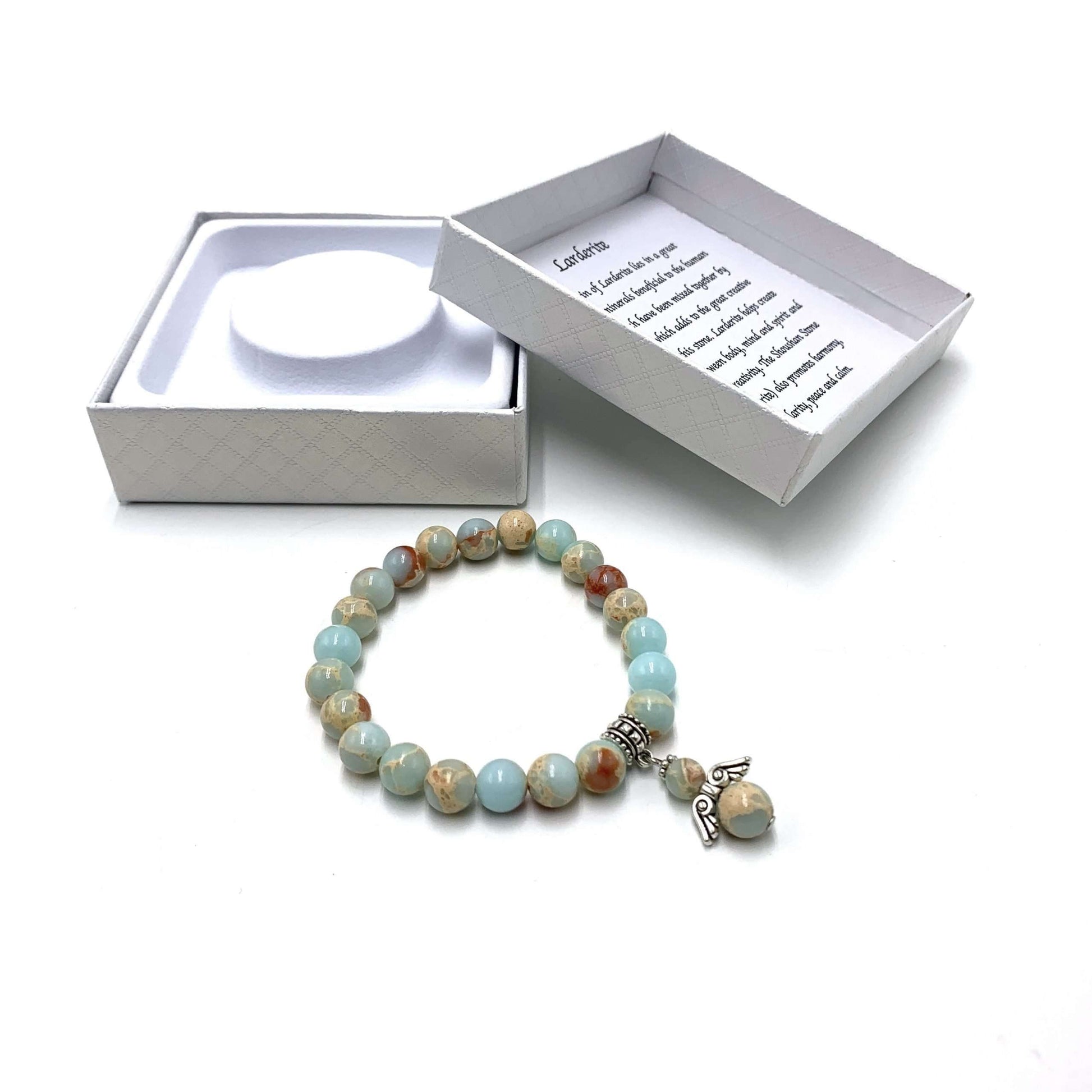 Multicolored beaded bracelet with a charm on a white background
