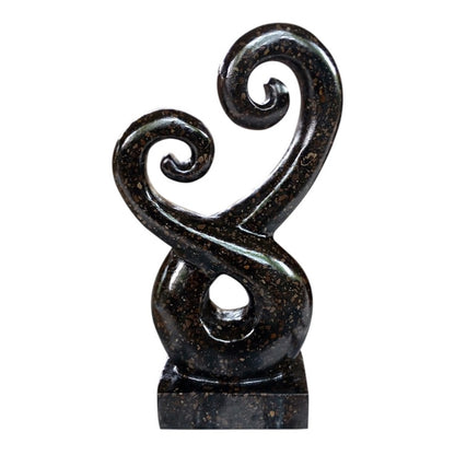 Terrazzo Koru Entwined Black 25cm&nbsp;
H:25 x W:17 x D:10 cm - Terrazzo Black Koru. Available in black or white. Comes wrapped in cardboard. It is recommended to apply a stone sealer every 9-12 months to protect from the elements. The Koru (Maori for 'loop') is a spiral shape based on the unfurling silver fern frond of the ponga plant. The Maori Koru design carries a spiritual meaning, one of peace, tranquility, positive change and new beginnings.

SKU: WT8595A-B