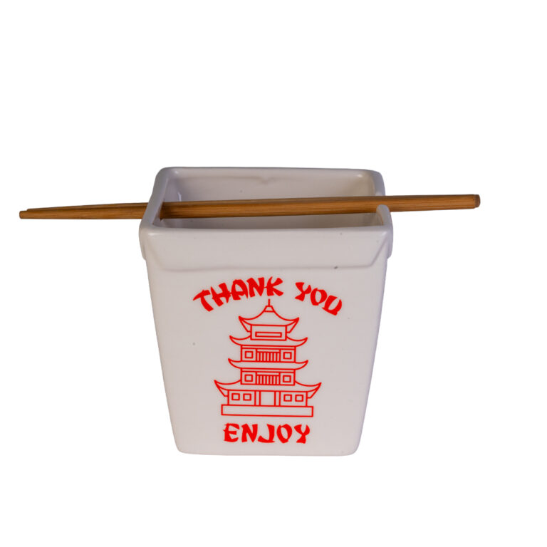 White container with red text and a pagoda design, accompanied by wooden chopsticks on a white background.