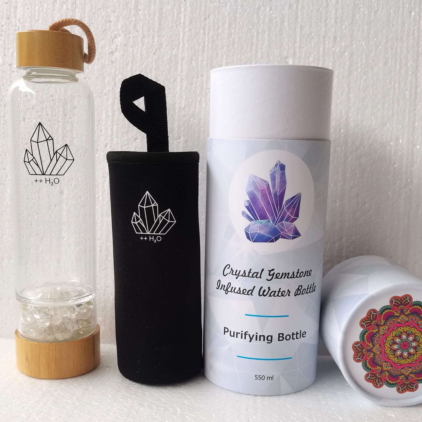 Set of crystal-themed water bottles and containers on a white background