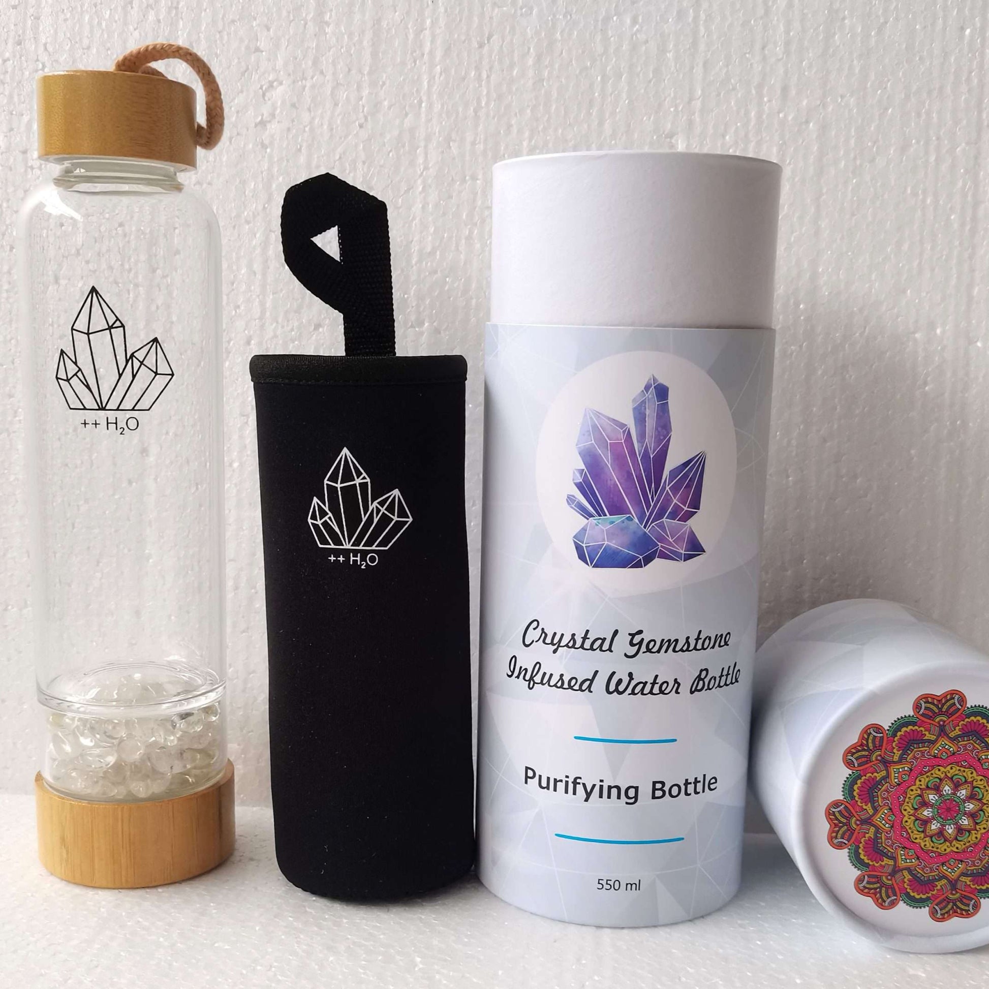 Set of crystal-themed water bottles and containers on a white background