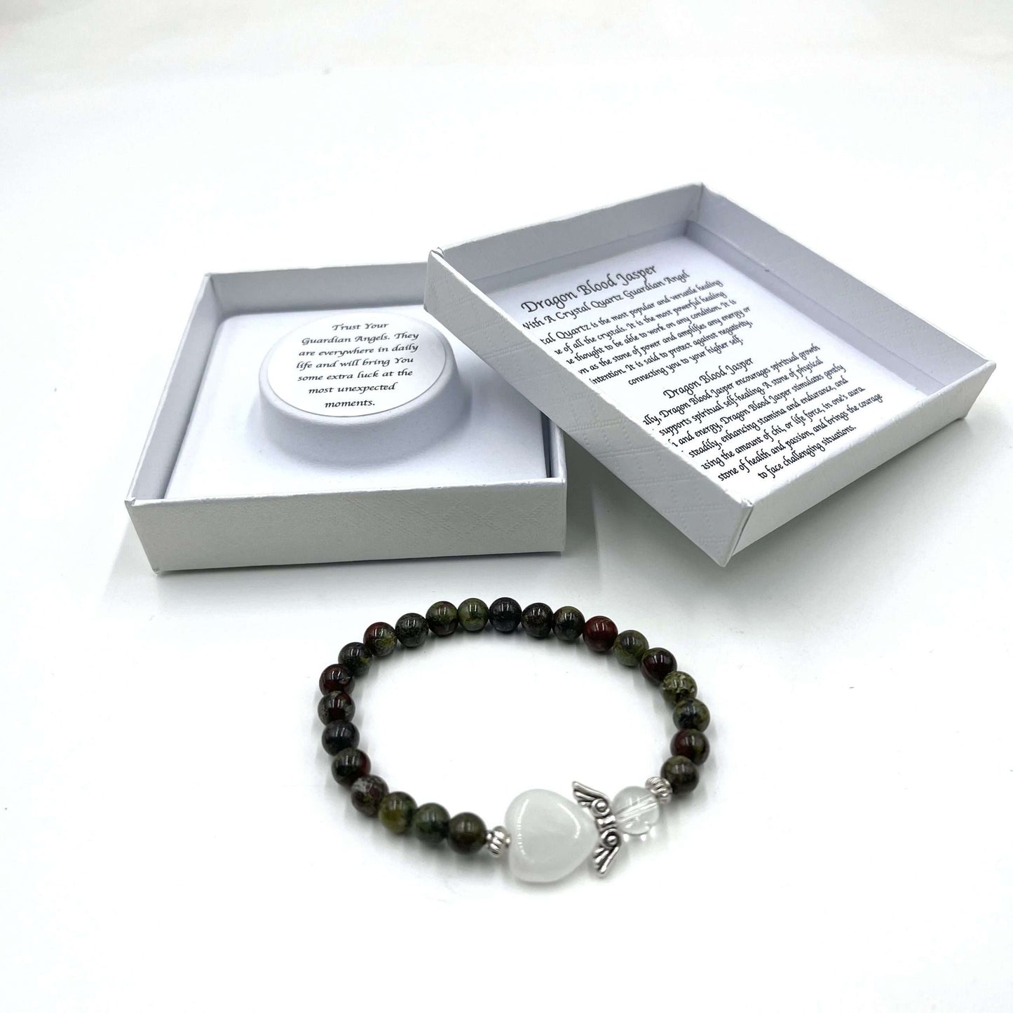 Beaded bracelet with a heart charm on a white background, featuring a branded box.