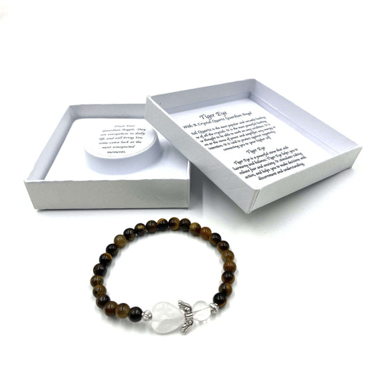 Beaded bracelet with a white stone charm on a white background, featuring a gift box with text.
