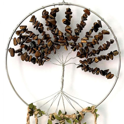 Decorative dreamcatcher with natural elements on a white background