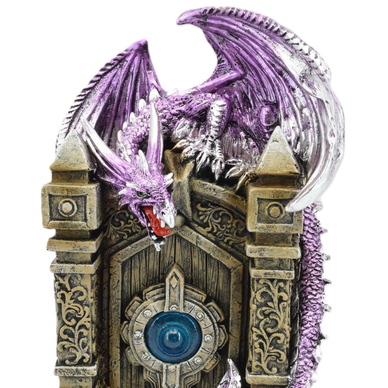 Decorative figurine of a dragon on a stone archway with purple accents