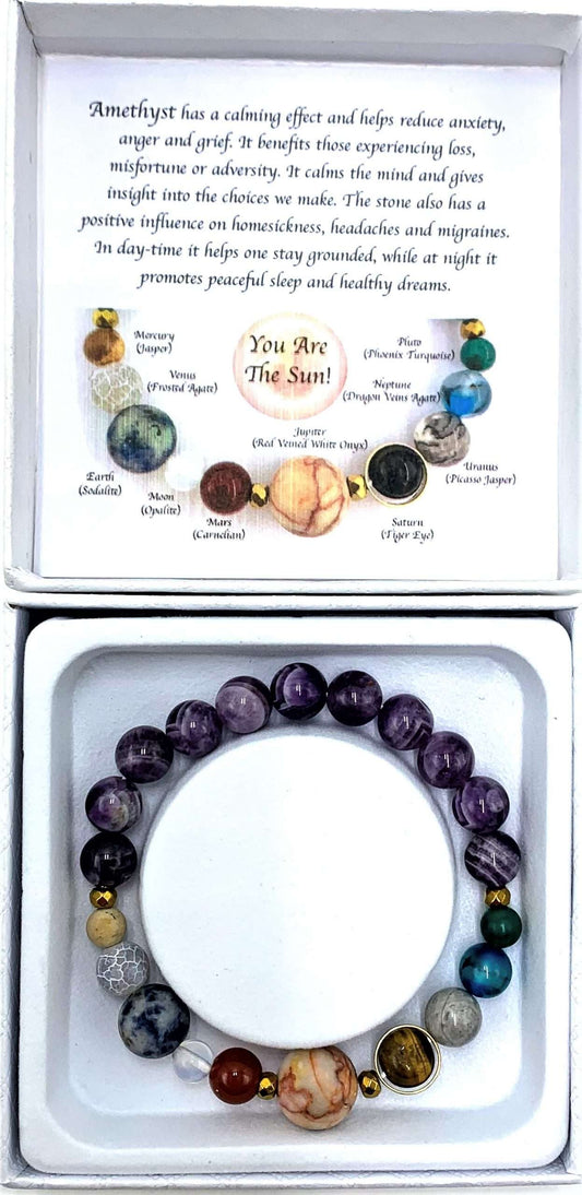 Bracelet with colored beads and information card on a white background