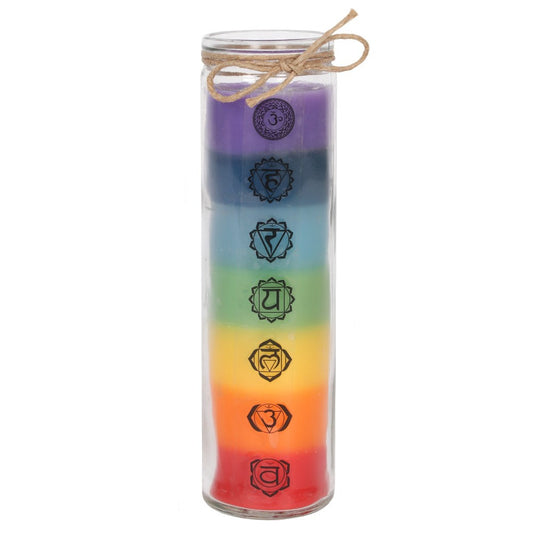 Candle in a glass jar with rainbow color gradient and chakra symbols on a white background