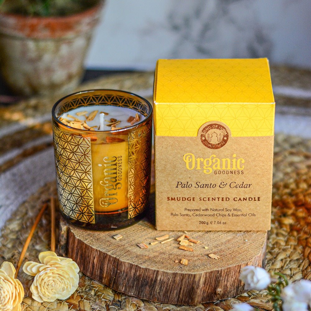 Candle Palo Santo &amp; Cedar 200gm Organic Goodness
200 gram 50 hour burn time Smudge Scented Candle in gold foil glass prepared with natural soy wax, Palo Santo, Cedarwood Chips, essential oils &amp; pure cotton wick. A purchase helps support over 10,000 families in India. It also helps support kids who are very poor by providing schooling.1st Stop, Marshall's Health Shop, Gift Shop!