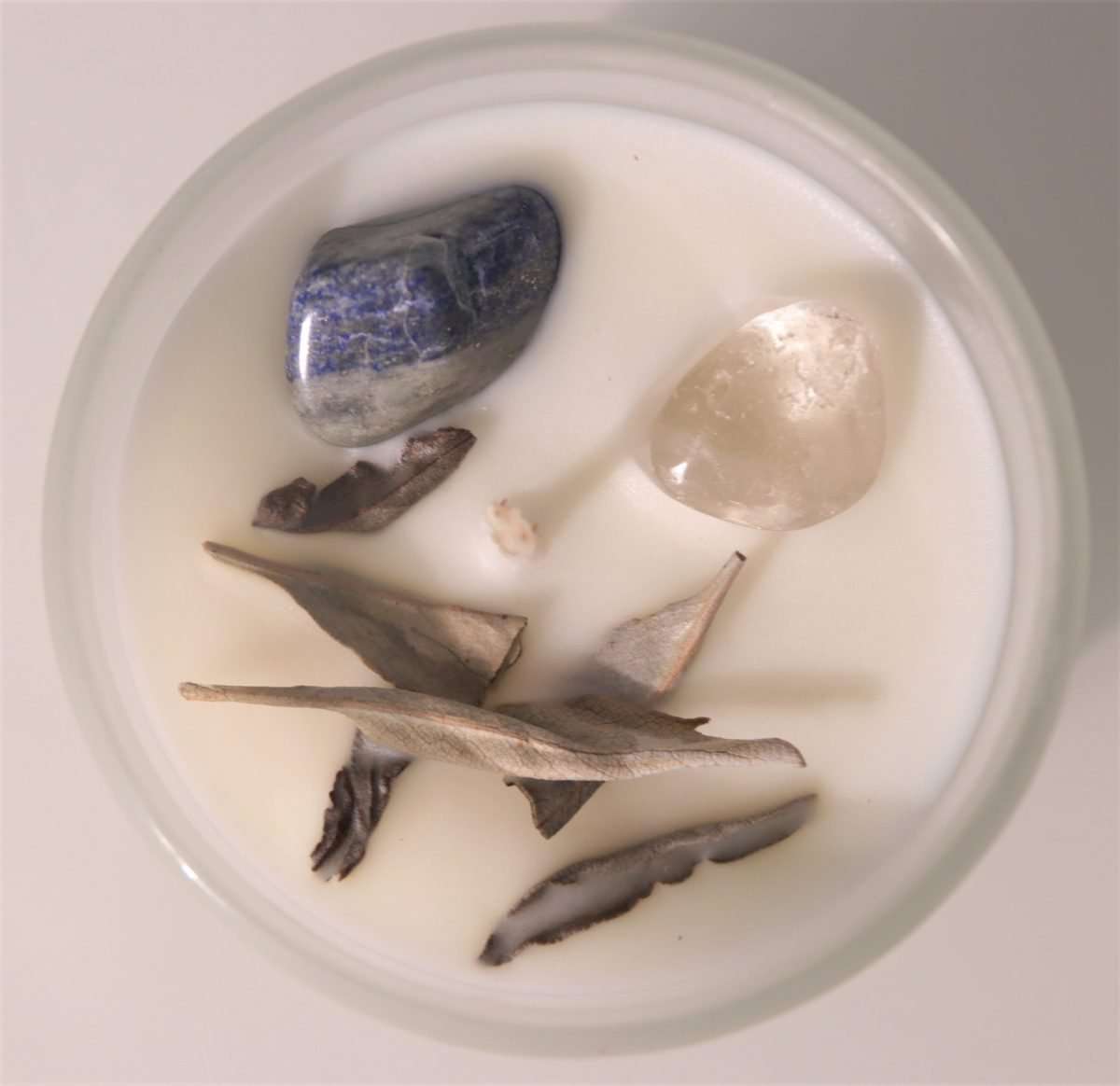 Crystal Soy Wax Candle White Sage, Clear Quartz and Lapis  Comes with White Sage, Clear Quartz and Lapis Natural Soy Wax.  40 hours burn time. 8×9.3cm with 200g wax.  SKU: CA9