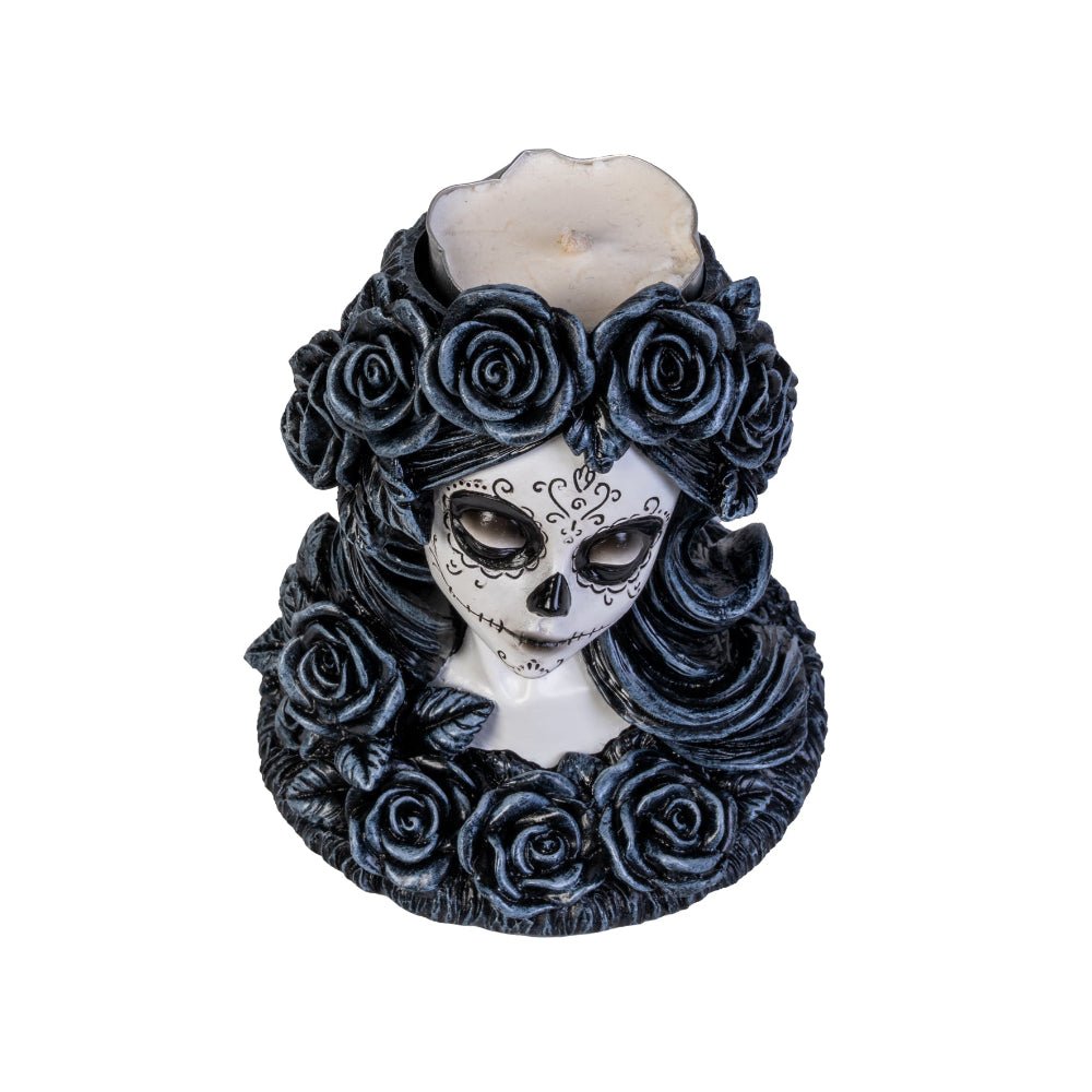Meet the Dead Beautiful Tealight Holder, your new gothic table companion! Crafted in the likeness of a sweet yet spooky sugar skull maiden, this candle holder is ready to haunt your home with a delightful touch of mystery and charm. Complete with intricately sculpted roses and Day of the Dead face art, she is as perfect for a chilling dinner party as she is for turning any ordinary night into an enchanting spectacle!  1st Stop, Marshall's Health Shop, Gift Shop!