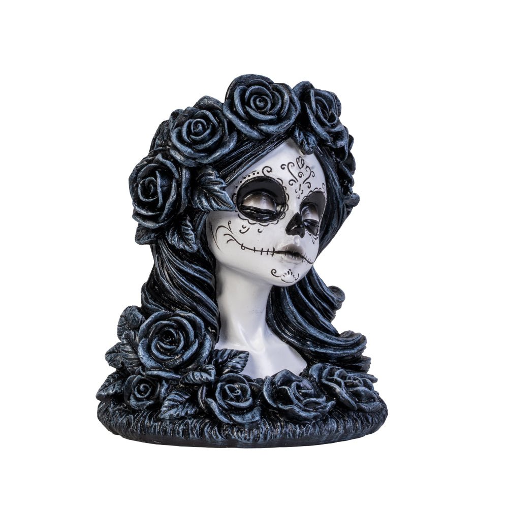 Meet the Dead Beautiful Tealight Holder, your new gothic table companion! Crafted in the likeness of a sweet yet spooky sugar skull maiden, this candle holder is ready to haunt your home with a delightful touch of mystery and charm. Complete with intricately sculpted roses and Day of the Dead face art, she is as perfect for a chilling dinner party as she is for turning any ordinary night into an enchanting spectacle!  1st Stop, Marshall's Health Shop, Gift Shop!