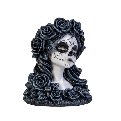 Meet the Dead Beautiful Tealight Holder, your new gothic table companion! Crafted in the likeness of a sweet yet spooky sugar skull maiden, this candle holder is ready to haunt your home with a delightful touch of mystery and charm. Complete with intricately sculpted roses and Day of the Dead face art, she is as perfect for a chilling dinner party as she is for turning any ordinary night into an enchanting spectacle!  1st Stop, Marshall's Health Shop, Gift Shop!