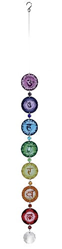 A vertical suncatcher with seven chakra-colored circles, each with a symbol inside, hanging from a loop.