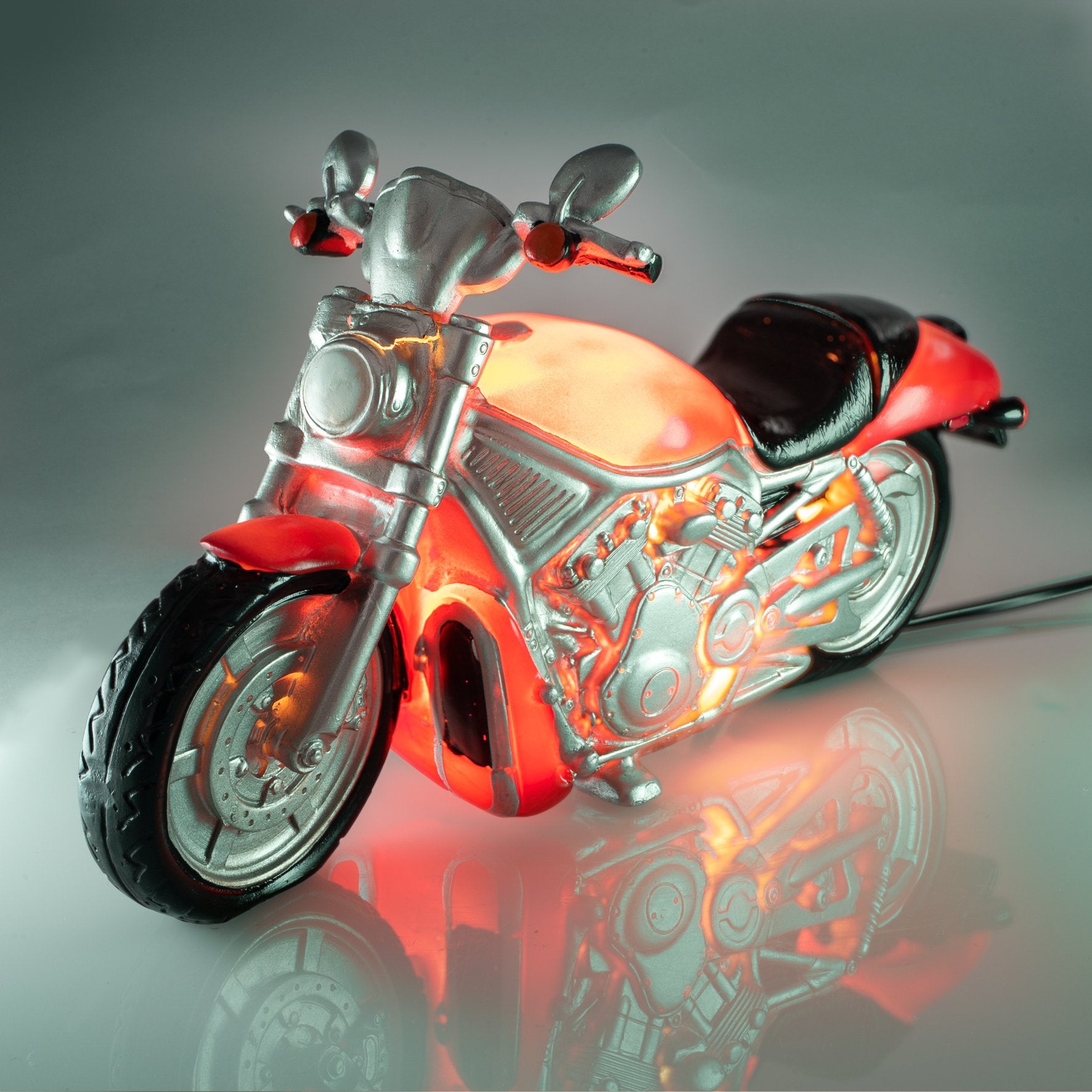 Motorcycle Table Lamp LED Table night light designed as a smart looking motorcycle Soft warm glow and safe low-voltage adaptor makes it perfect for child’s bedrooms Matches well with our other cute and fun table lamps