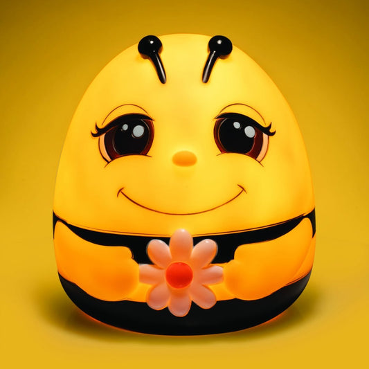 Smoosho’s Pals Bee Table Lamp Adorable bumble bee table lamp based on our lovable Smoosho’s Pals! Lights up the room with a comforting warm glow Makes a BEE-autiful ornament during the day Low voltage LED safe for children The adorable Smoosho’s Pals Bee lamp is the perfect combo of function and decor! It blends right into a fun kid’s room during the day, and lights up with a golden glow at night. Great for bedtime stories or as a nightlight to ensure sweet dreams for your little one.