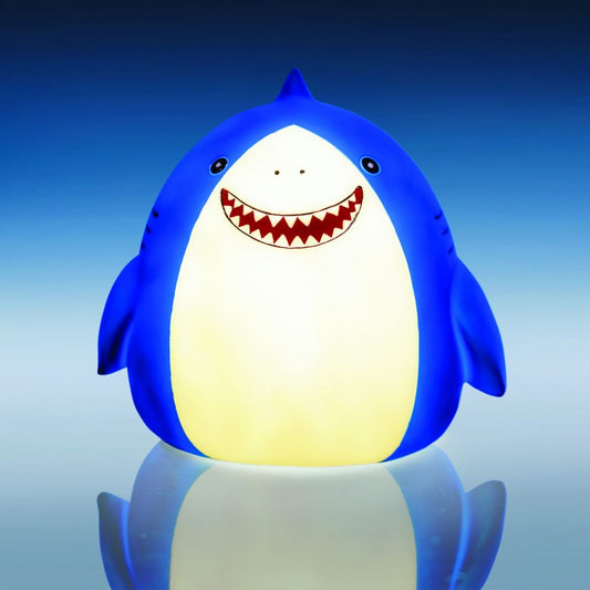 Smoosho’s Pals Shark Table Lamp Adorable shark table lamp based on our lovable Smoosho’s Pals! Lights up the room with a comforting warm glow Makes a FINtastic ornament during the day Low voltage LED safe for children The adorable Smoosho’s Pals Shark lamp is the perfect combo of function and decor! It blends right into a fun kid’s room during the day, and lights up with a golden glow at night. Great for bedtime stories or as a nightlight to ensure sweet dreams for your little one.