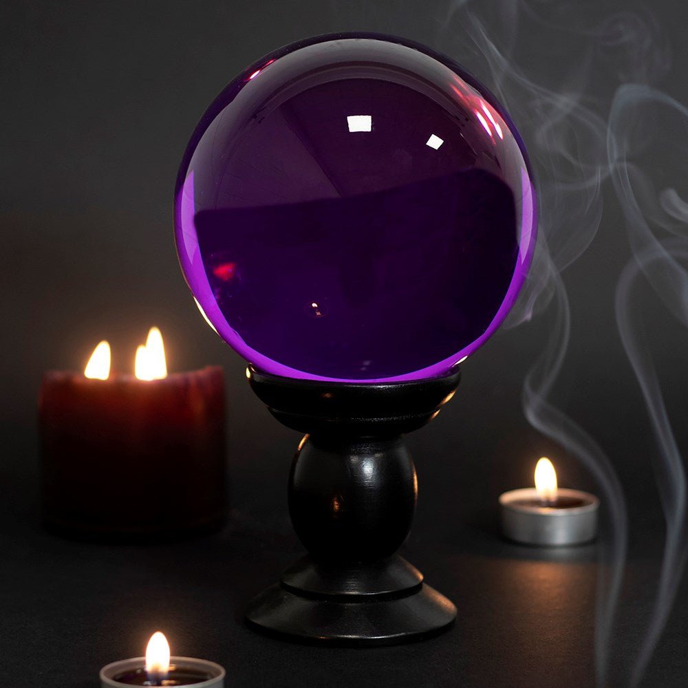 Crystal Ball Purple Large/Wooden Stand&nbsp;
Purple Large Crystal Ball on Wooden Stand 130mm
H:20 x W:13 x D:13 cm - Glass &amp; MDF. This large, purple crystal ball is not only a powerful tool in fortune telling and scrying, but also makes an eye-catching piece of decor. Whether used for divination or a table accessory at Halloween, this crystal ball is sure to be a conversation piece. Comes on black wooden stand and a beginners guide to Crystal Balls. K1st Stop, Marshall's Health Shop, Gift Shop!