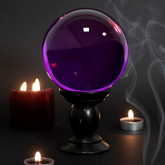 Crystal Ball Purple Large/Wooden Stand&nbsp;
Purple Large Crystal Ball on Wooden Stand 130mm
H:20 x W:13 x D:13 cm - Glass &amp; MDF. This large, purple crystal ball is not only a powerful tool in fortune telling and scrying, but also makes an eye-catching piece of decor. Whether used for divination or a table accessory at Halloween, this crystal ball is sure to be a conversation piece. Comes on black wooden stand and a beginners guide to Crystal Balls. K1st Stop, Marshall's Health Shop, Gift Shop!