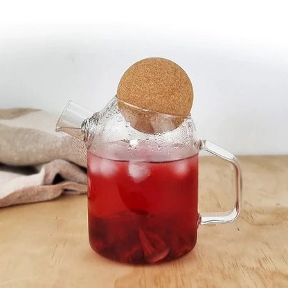 MagicT -  Cork Lid Teapot 450cc The glass cork lid teapot is transparent and clear and made of high borosilicate glass making it resistant to cold or hot drinks.  It has a capacity of 450 ml and its spring strainer in the nozzle makes it easier to use for both hot and cold tea.