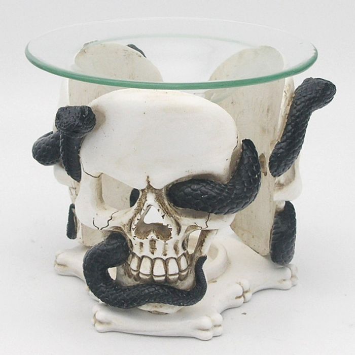 Skull and Serpent Resin Oil &amp; Wax Burner with Glass Dish
Material:&nbsp;Resin with a Glass Dish
Suitable for Use With:&nbsp;Water and oils, wax tarts, wax melts or granules.
Candle Included:&nbsp;No
Wax, Oil or Granules Included:&nbsp;No
Safety Information:&nbsp;Always read and follow the instructions that come with this product. Use a good quality standard tea light and do not overfill the dish.

1st Stop, Marshall's Health Shop, Gift Shop!

SKU: SK340