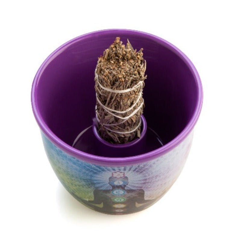 Wild Scents Chakra Ceramic Smudge Bowl
Quality ceramic smudge bowl perfect for holding sage &amp; catching cinders during cleansing rituals
Meditating figure with chakra symbols on an ethereal rainbow bowl
Specially moulded internal holder keeps sage smudge sticks upright for safe burning
Never leave burning sage unattended. Keep away from children and pets.
12.50(L) x 12.50(W) x 10.50(H) cm

1st Stop, Marshall's Health Shop, Gift Shop!

SKU: TJ-SB/C