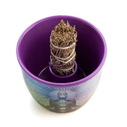 Wild Scents Chakra Ceramic Smudge Bowl
Quality ceramic smudge bowl perfect for holding sage &amp; catching cinders during cleansing rituals
Meditating figure with chakra symbols on an ethereal rainbow bowl
Specially moulded internal holder keeps sage smudge sticks upright for safe burning
Never leave burning sage unattended. Keep away from children and pets.
12.50(L) x 12.50(W) x 10.50(H) cm

1st Stop, Marshall's Health Shop, Gift Shop!

SKU: TJ-SB/C